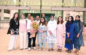 Federal Minister for Information Technology and Telecommunication, Shaza Fatima Khawaja, and former Pakistan Women’s Cricket Team captain Sana Mir pose for a group photograph with others at Islamabad Airport,The Federal Minister welcomed Sana Mir who has become the first Pakistani woman cricketer to be inducted into the ICC Hall of Fame