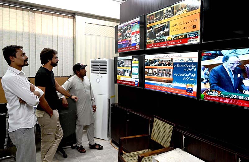 Citizens watching the 2025-26 federal budget live on television screens