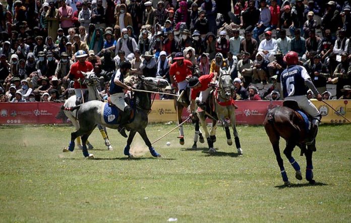 Polo players from Gilgit and Chitral teams in action during a freestyle match at the world’s highest polo ground at the annual Shandur Polo Festival