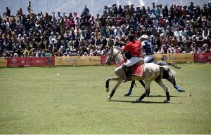 Polo players from Gilgit and Chitral teams in action during a freestyle match at the world’s highest polo ground at the annual Shandur Polo Festival