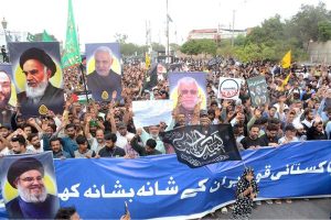 A large number of people take part in a protest rally at MA Jinnah Road against the Israeli and U.S. attacks on Iran.