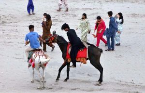 A large number of people arrive at Al-Manzar Picnic Point to enjoy boat rides, camel and horse rides.