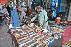 Blacksmith busy sharpen the knife to be used for slaughtering sacrificial animals during Eidul Azha