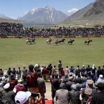 Spectators enjoy the freestyle polo match as players from Gilgit and Chitral teams compete at the world’s highest polo ground during the annual Shandur Polo Festival