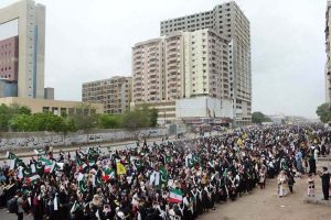 A large number of people take part in a protest rally at MA Jinnah Road against the Israeli and U.S. attacks on Iran.