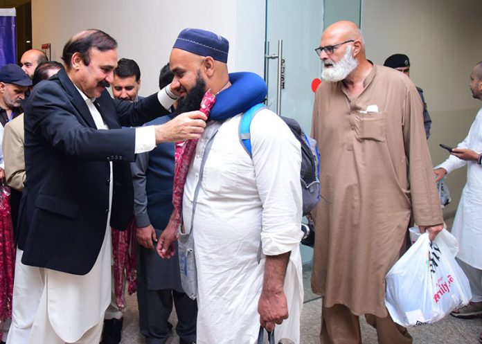 Dr. Tariq Fazal Chaudhary, Federal Minister for Parliamentary Affairs, welcomes the Hajj Pilgrims came back from Saudi Arabia at Islamabad Airport
