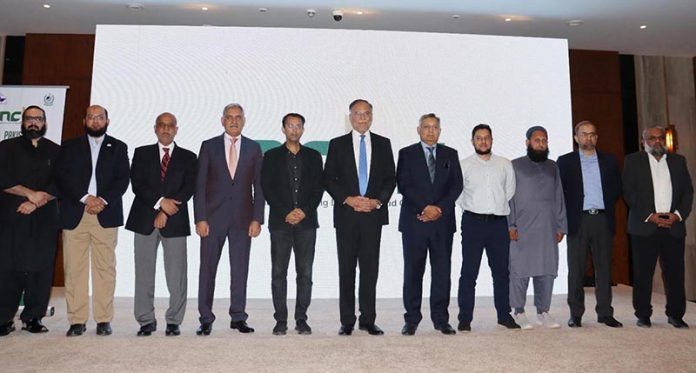 Federal Minister for Planning Ahsan Iqbal at the launching ceremony of the National Open Data Portal, accompanied by Dr. Naveed Arshad, Director NCBC, LUMS, and his team in federal capital