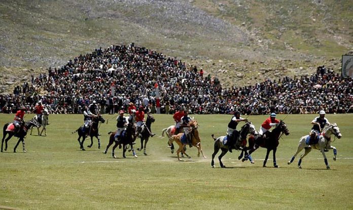 Polo players from Gilgit and Chitral teams in action during a freestyle match at the world’s highest polo ground at the annual Shandur Polo Festival