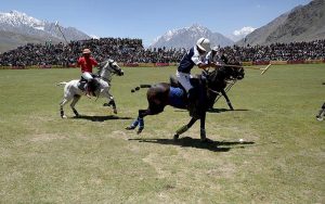 Polo players from Gilgit and Chitral teams in action during a freestyle match at the world’s highest polo ground at the annual Shandur Polo Festival