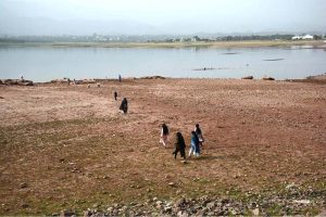A view of Rawal Lake with significantly reduced water levels, reflecting the impact of ongoing drought conditions