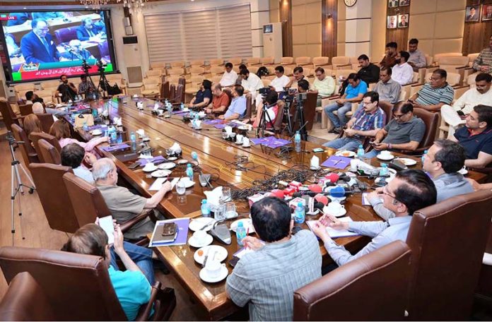 Business community watching the 2025-26 federal budget live on television screen at Chamber of Commerce