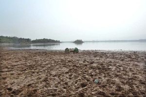 A view of Rawal Lake with significantly reduced water levels, reflecting the impact of ongoing drought conditions
