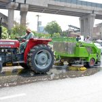 Sanitation workers wash roads as part of the ongoing Clean Punjab Campaign at Chowk Gaddafi, aiming to improve hygiene and enhance urban beautification