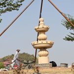 Laborers work on the construction of a fountain under the supervision of CDA near Satra Meel Toll Plaza