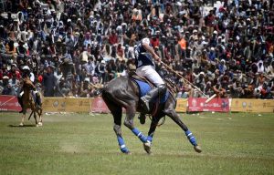 Polo players from Gilgit and Chitral teams in action during a freestyle match at the world’s highest polo ground at the annual Shandur Polo Festival
