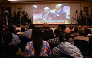 Business community watching the 2025-26 federal budget live on television screen at Chamber of Commerce