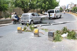 Open main hole of sewerage system on main roads of the city posing threat to passersby and routine traffic