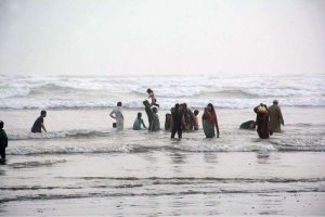 Despite the scorching heat, a family enjoys a horseback ride along the breezy coast of Seaview to enjoy a summer vacation by the sea