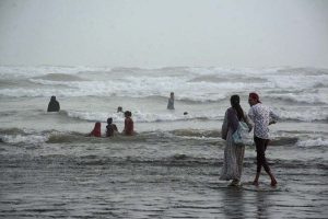 Despite the scorching heat, a family enjoys a horseback ride along the breezy coast of Seaview to enjoy a summer vacation by the sea