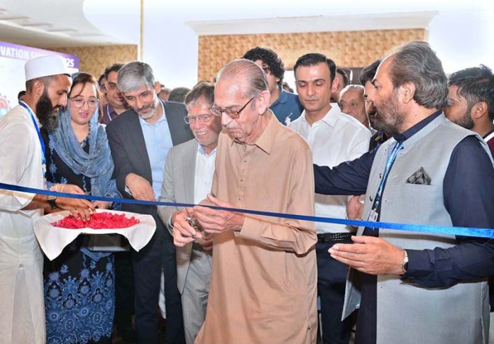 MPA Chaudhry Faisal Ikram, Sheikh Riazuddin (Chairman SIMAP), and Zeeshan Tariq inaugurate the Technology and Innovation Summit 2025 at a private marquee