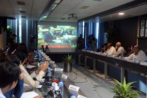 Business community watching the 2025-26 federal budget live on television screen at Chamber of Commerce and Industry (FCCI)