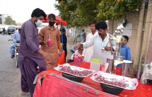 People enjoying falsa drink during hot weather at Joint Road.