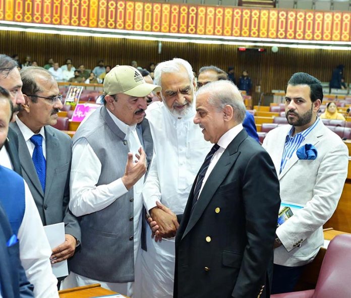 Prime Minister Muhammad Shehbaz Sharif interacts with Members of the National Assembly during the budget session
