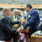 Prime Minister Muhammad Shehbaz Sharif congratulates Federal Minister for Finance and Revenue Muhammad Aurangzeb after his budget speech