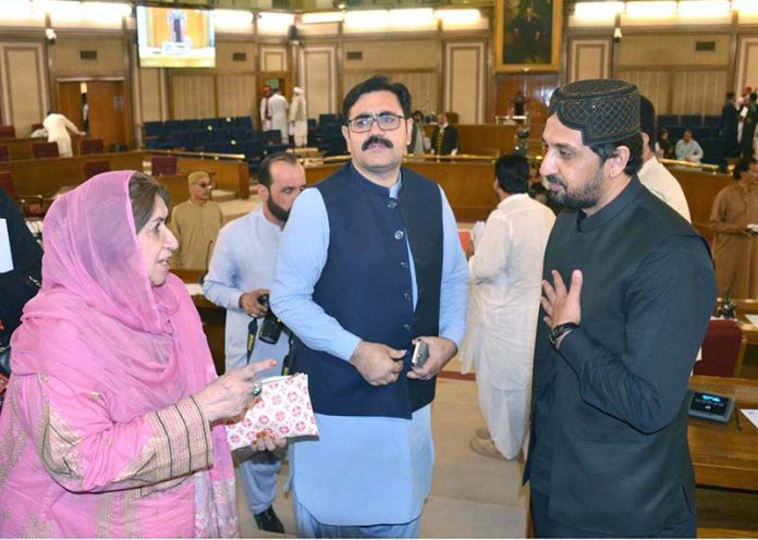 Members of the Balochistan Assembly greet Finance Minister Mir Shoaib Nosherwani after he presented the provincial surplus budget for FY 2025–26