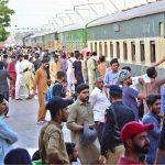 People boarding on train at Railway Station to leave for their hometowns to celebrate Eid-ul-Azha with their loved ones