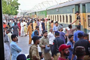 People boarding on train at Railway Station to leave for their hometowns to celebrate Eid-ul-Azha with their loved ones