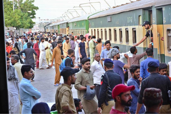 People boarding on train at Railway Station to leave for their hometowns to celebrate Eid-ul-Azha with their loved ones