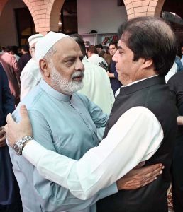 Federal Minister for Railways Muhammad Hanif Abbasi exchanging Eid greetings with people after offering Eidul Azha prayers at Jamia Masjid Al-Aqsa, Satellite Town