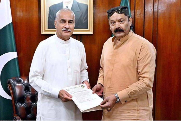 Chairman Parliamentary Committee on Kashmir Rana Muhammad Qasim Noon presenting comprehensive Report of the Parliamentary Committee on Kashmir visit to the United Kingdom to Speaker National Assembly Sardar Ayaz Sadiq at Parliament House