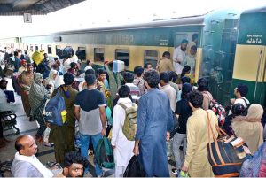 People boarding on train at Railway Station to leave for their hometowns to celebrate Eid-ul-Azha with their loved ones