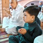 A youngster offering dua after Eidul Azha prayers at Jamia Masjid Al-Aqsa, Satellite Town