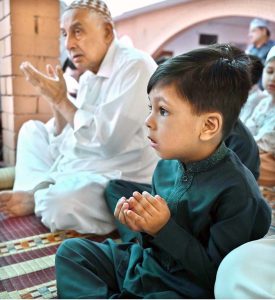 A youngster offering dua after Eidul Azha prayers at Jamia Masjid Al-Aqsa, Satellite Town