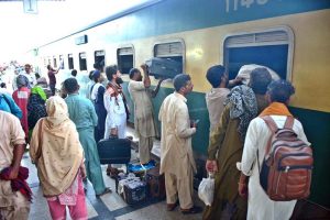 People boarding on train at Railway Station to leave for their hometowns to celebrate Eid-ul-Azha with their loved ones