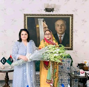 BISP chairperson Rubina Khalid presenting bouquet to PPP leader MPA Faryal Talpur.
