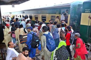 People boarding on train at Railway Station to leave for their hometowns to celebrate Eid-ul-Azha with their loved ones