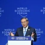 Li Qiang attends symposium of business representatives at Davos in summer 2025