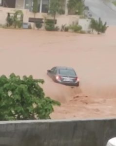 Retired officer, daughter swept away as car submerged in housing society's drain
