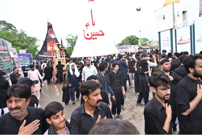 A large number of mourners participating in the main procession of 9th Muharram-ul-Haram, commonly known as Youm-e-Ashura in G-6 sector. Muharram-ul-Haram, the first month of the Islamic calendar, is a period of mourning in remembrance of the martyrdom of Hazrat Imam Hussain (AS), the grandson of the Holy Prophet Muhammad (SAWW), along with his family and companions at Karbala