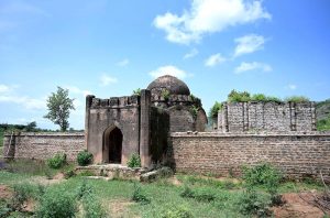 A view of the tomb of Sultan Muqarab Khan, tomb measuring 7x7x3.5m, octagonal in shape, having its entrance to the east. It has low height dome decorated with leaf patterns. Muqarab Khan Tomb located at a small village ‘Bagh Jogian’ in the vicinity of Islamabad. Sultan Muqarab Khan (1719-1769 C.E.) was last chieftain of Gakhar tribe. He sided with Nadir Shah and took part in the battle of Karnal in 1739 C.E. As a reward for his services, he was confirmed in his possession of the fort of Pharwala. In 1765 C.E he was defeated by the Sikhs under Sardar Milka Singh at Gujrat and had to surrender the whole of his possessions up to Jhelum. Four year later in 1769 C.E., he was treacherously captured by a rival chief, Himmat Khan and put to death.
