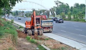 Heavy machinery is being used to excavate land for the construction of a boundary wall along Srinagar Highway, part of efforts to enhance the beauty of Federal Capital