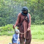 A CDA worker trims grass along the roadside in the Federal Capital as part of routine maintenance