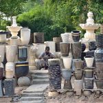 A vendor waits for customers to sell plant pots at Rawal Dam Chowk in the Federal Capital