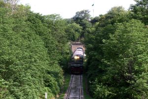 A Pakistan Railways train from Rawalpindi to Lahore, passing through the Korang Tunnel, The tunnel is part of an integrated infrastructure, located adjacent to the Korang Bridge, which spans the Korang River - originating from the Murree Hills constructed by British engineers in 1914, the short 50 meter long tunnel is marked by engineering difficulties, owing to cutting through hard rock, Korang Tunnel is an active segment of the Karachi–Peshawar Railway Line, (ML-1). The Lahore-Rawalpindi section constitutes a crucial part of the extensive network of Pakistan Railways spanning 7,789 kilometers