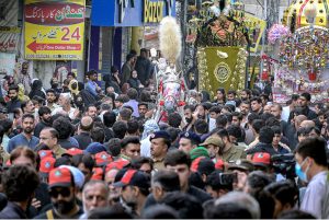 Shia Muslims attend the mourning procession of 10th Muharram ul Harram, to commemorate the death anniversary of Hazrat Imam Hussein, the grandson of prophet Muhammad (PBUH) and his companion, who were martyred in the battle of Karbala, Iraq