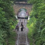 Railway workers carry out repair work on the track near Korang Tunnel — a historic 50-meter-long structure built in 1914 by British engineers. Located adjacent to the Korang Bridge, which spans the Korang River originating from the Murree Hills, the tunnel is part of the active Karachi–Peshawar Railway Line (ML-1)